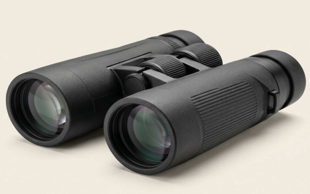 Best birding binoculars under 200 dollars showing a matte black roof-prism chassis with fully multi-coated objective lenses.
